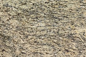 A gold granite with flowing grains of white brown and black.