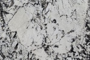 A white and gray granite with dense black crystal streaks.
