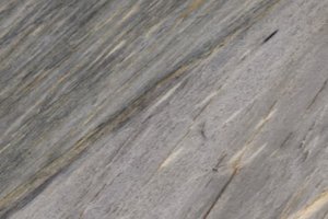 A gray granite with blue undertones and warm gold veining.