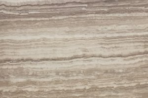 A light beige travertine with soft cream tones and subtle horizontal banding.