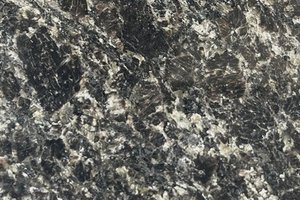 A dark gray granite with coarse mottling.
