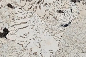 A cream granite with darker accents.