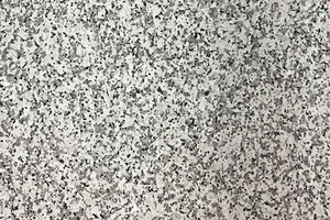 A white granite with large grains of black and grey