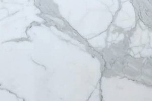 A white marble with bold gray veining and natural variation from slab to slab.