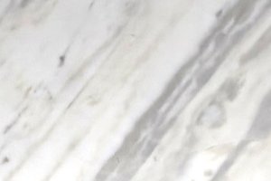 A white marble with soft gray veining and subtle tonal variation.