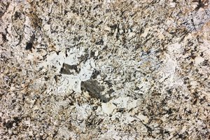 A creme  granite with grey, gold and black.