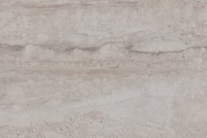 A light beige limestone with soft cream tones and subtle horizontal banding.