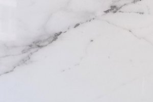 A soft white marble with gray veining.