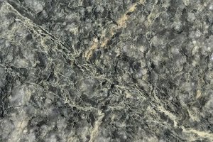 A dark green granite with dense speckling and subtle mineral movement.