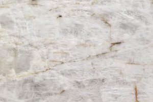 A white granite with translucent crystalline areas.
