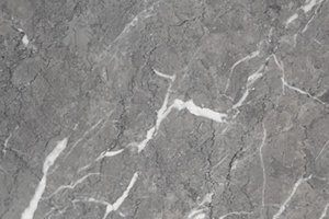 A gray marble with soft tonal variation and irregular white veining.