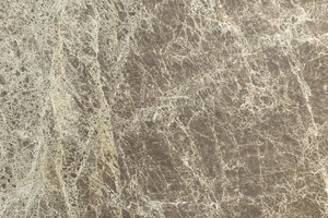 A warm taupe-brown marble with fine ivory veining and a soft, blended pattern.