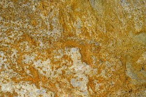 A medium grained, yellow granite that may have some pink.