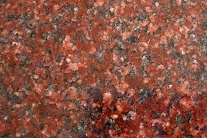 A deep red granite with black and gray speckling.