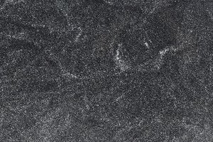 A black granite with fine grain and subtle tonal movement.