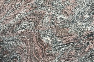 A charcoal and deep mauve granite with sweeping black and dusty rose movement.