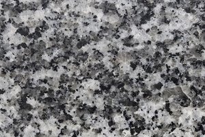 A white granite with dense black and gray speckling.