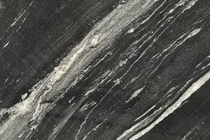 A deep black marble with striking veining.