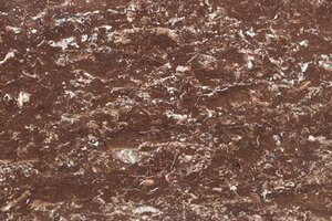 A reddish-brown stone with light white veining and mottled patterning.
