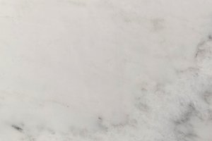 A white marble with soft gray patterning.