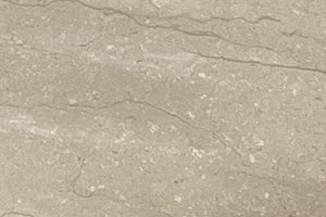 A light beige limestone with subtle fossil fragments and faint linear veining.