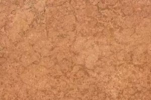 A warm reddish-brown marble with fine, mottled patterning.