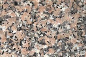 A pink granite with black, gray, and white speckling.