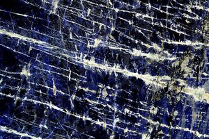 A blue and black granite with white veins.