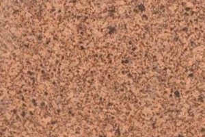 A pinkish-brown granite with fine black and gray speckling.