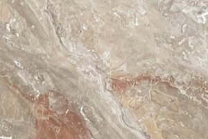 A peach and beige marble with bold veining and layered movement.