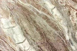 A beige and brown granite with flowing linear movement and soft gray accents.