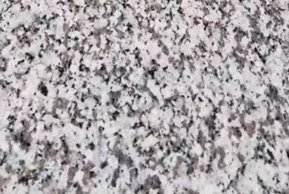 A light gray granite with fine black and white speckling.