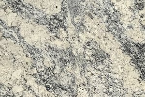 A white and gray granite with fine black and taupe speckling.