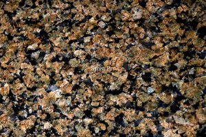 A medium grained, brown granite with black flecks.