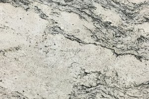 A white granite with beige variation and misty veins of grey.