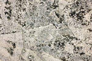 A beige granite with black veins.