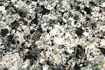 A white and grey, low variation granite that contains Amethyst Quartz.