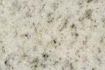 A white granite with grey spots.