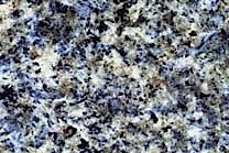 A medium grained, blue granite with white and green colors.