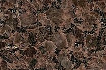 A brown granite with dark and light flecks.