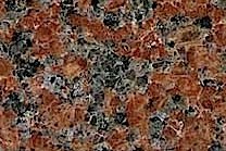 A medium grained, red granite with black and grey colors.