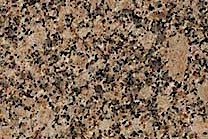 A brown granite scattered with greys, yellows, and golds.