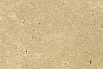 A light brown-beige travertine with a porous texture.