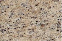 A beige granite that has a darker accents.