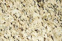 A beige granite with a cream-white background and black veins.