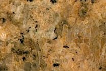 A coarse grained, golden-brown granite.