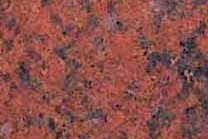 A red granite that has slight blue accents and a coarse texture.