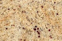 A gold and brown granite with redish garnets.