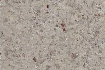 A white and grey granite that is fine to medium grained.