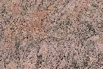 A pink and black granite with gray bands.